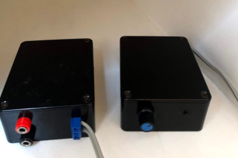 Two black Bluetooth stereo speaker amplifier boxes
